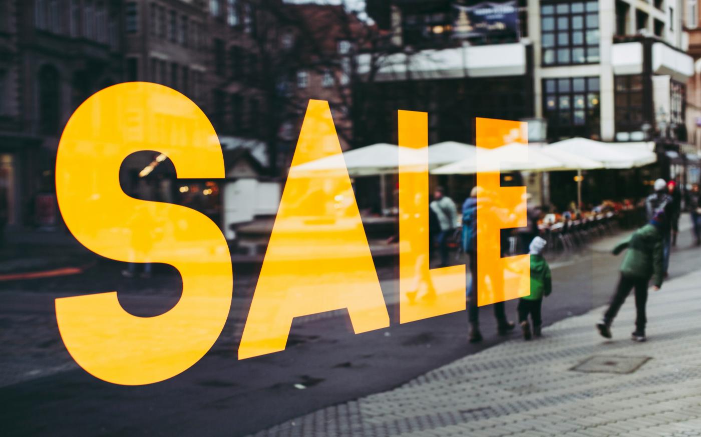 man in green jacket walking on sidewalk during daytime by Markus Spiske courtesy of Unsplash.