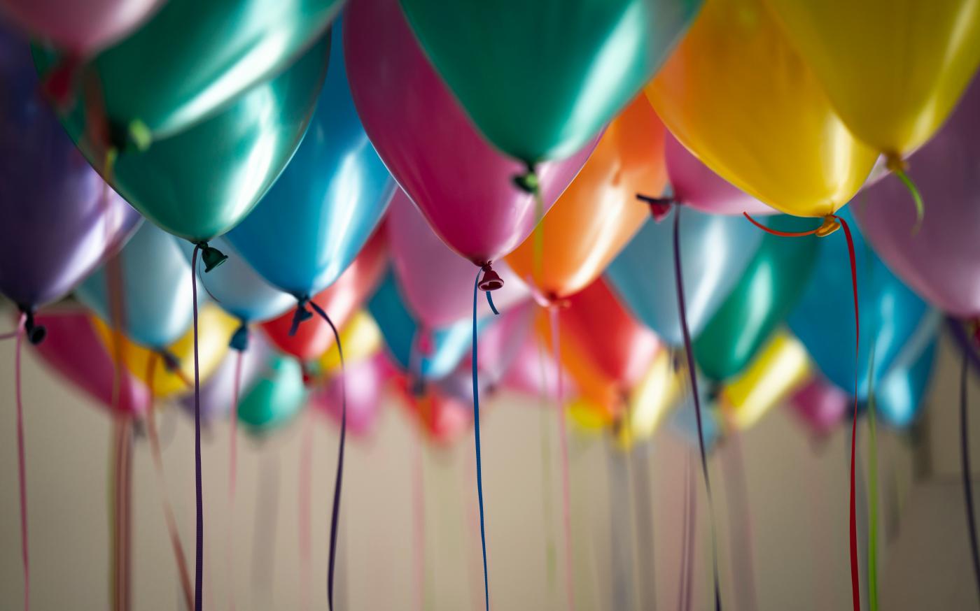 selective focus photography of assorted-color balloons by Adi Goldstein courtesy of Unsplash.